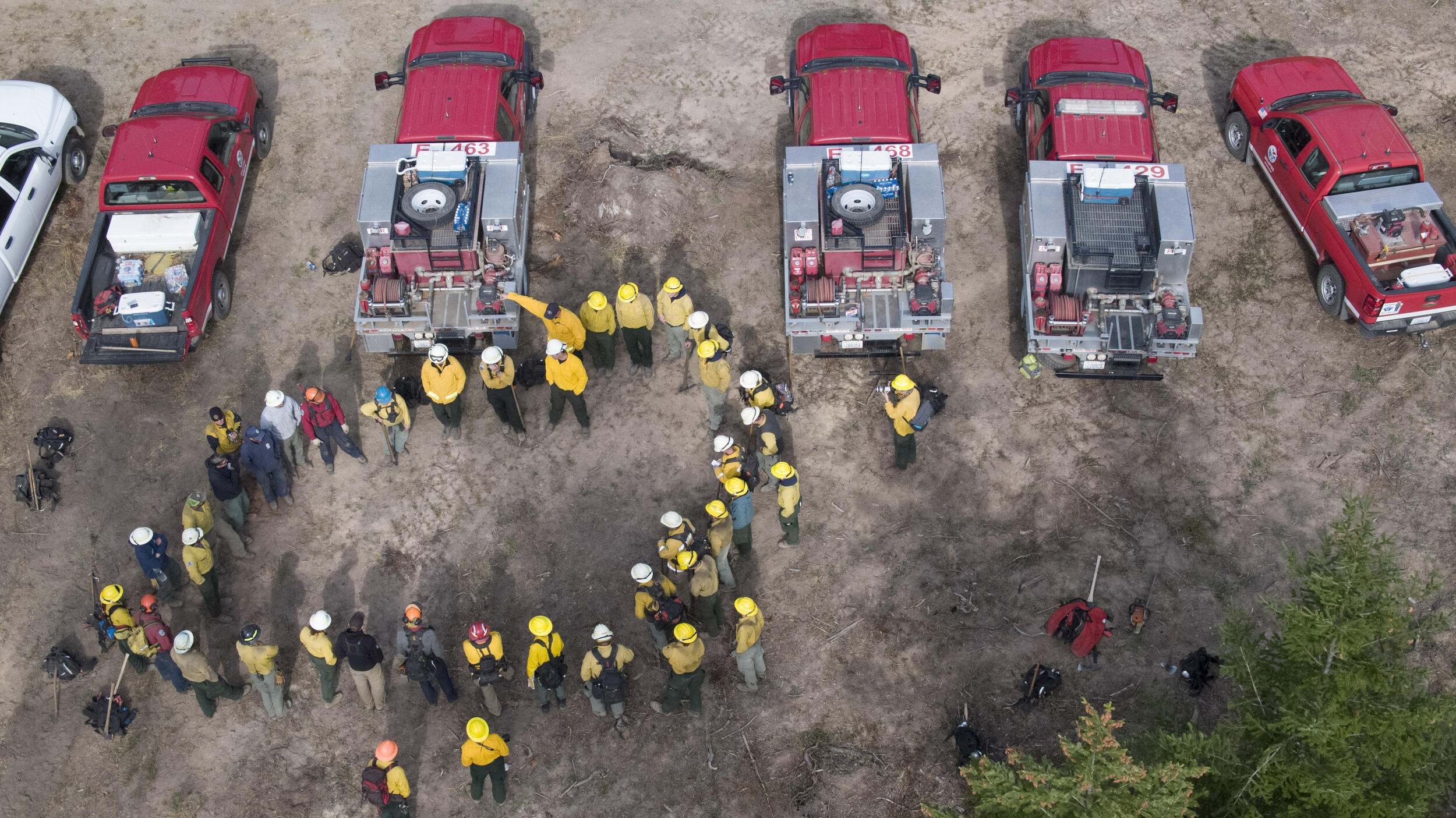 Group of wild firefighters gathered in a circle